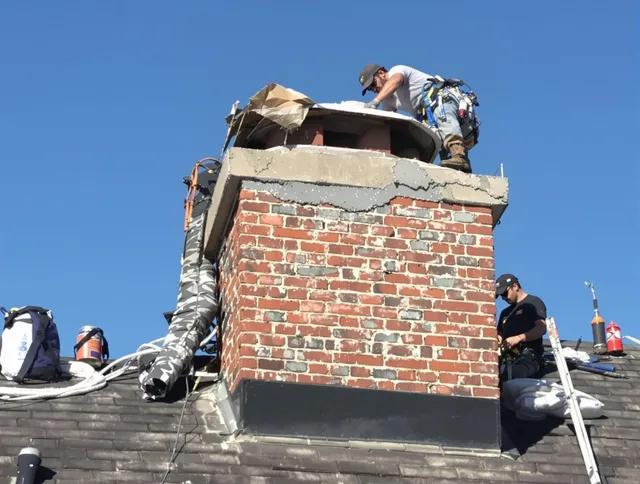Greenwich Chimney Sweep installing a custom chimney crown in Greenwich, CT
